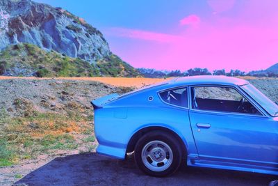 Car on road against mountain