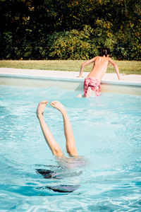 Children swimming in pool
