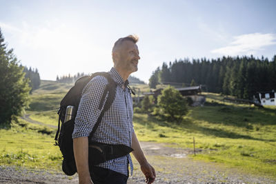 Rear view of man standing on field