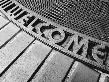 High angle view of text on metal railing