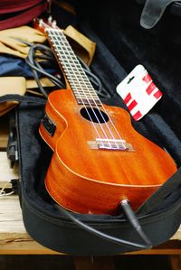 High angle view of guitar on table