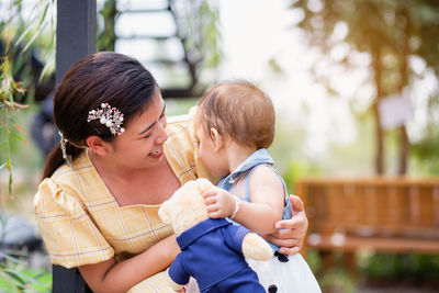 Mother and daughter outdoors