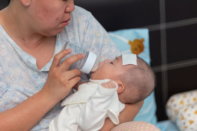 High angle view of mother and daughter at home