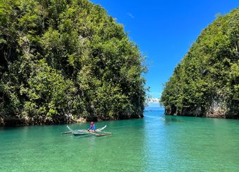 People kayaking in sea