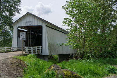 Built structure with trees in foreground