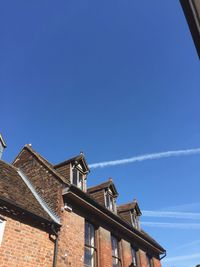 Low angle view of building against blue sky