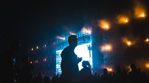 Silhouette people enjoying at music concert