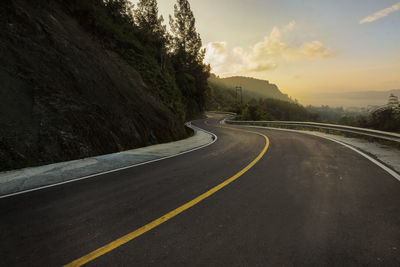 Winding road around samosir island overlooking breathtaking views of lake toba.
