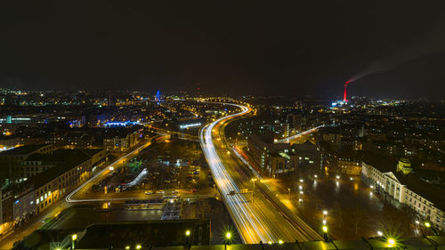 High angle view of illuminated buildings in city at night