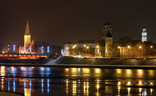 Illuminated buildings at waterfront