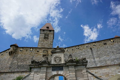 Low angle view of bell tower against sky