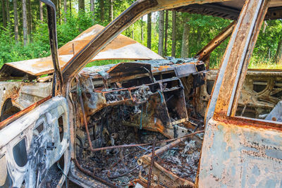 Damaged car in forest