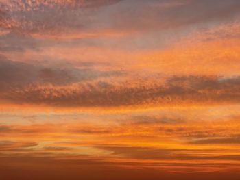 Low angle view of dramatic sky during sunset