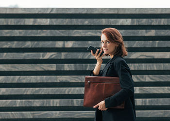 Young woman using mobile phone