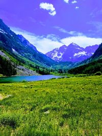 Scenic view of lake and mountains against sky