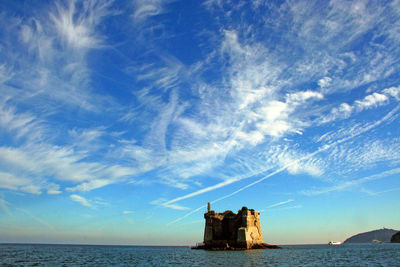 Scenic view of sea against blue sky