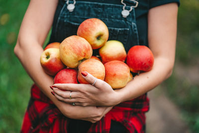 Close-up of hand holding fruits