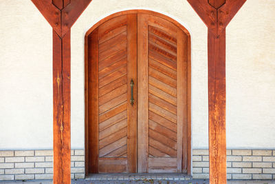 Closed wooden door of building