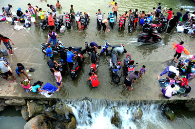 High angle view of people enjoying at beach