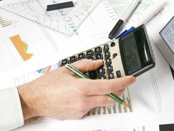 High angle view of man working on table