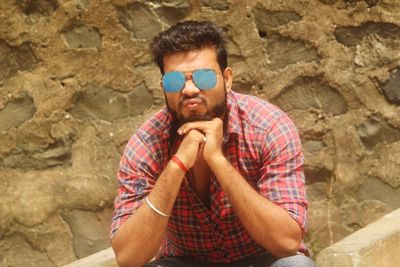 Portrait of young man wearing sunglasses