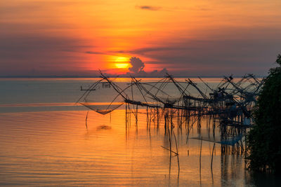 Scenic view of sea against orange sky