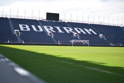 Scenic view of soccer field against sky