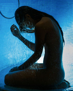 Side view of man in swimming pool