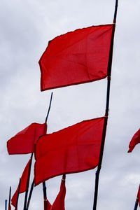 Low angle view of flag against sky