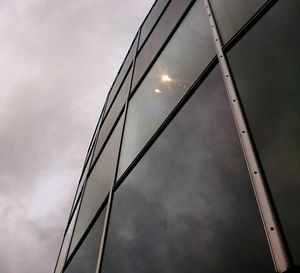 Low angle view of electricity pylon against sky