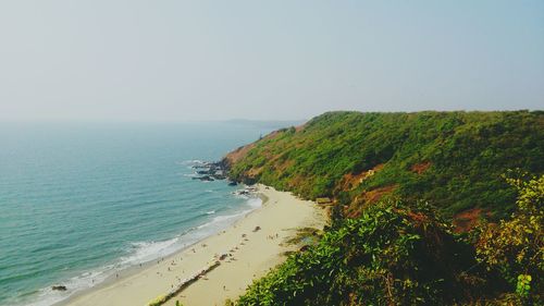 High angle view of calm blue sea against clear sky