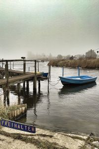 Boats in sea against sky