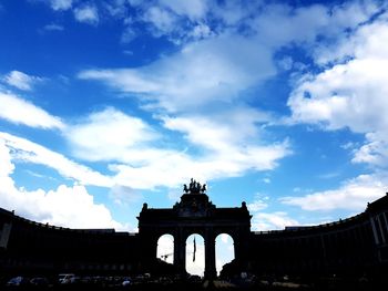 Low angle view of historical building against cloudy sky