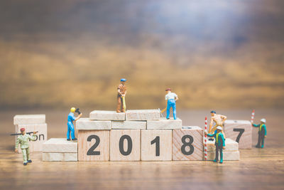 Group of people with toy on table