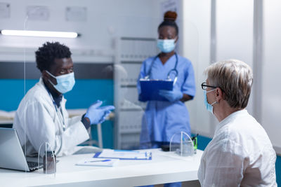 Patient and doctor discussing at hospital