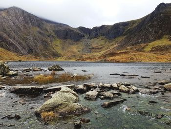 Scenic view of rocks in mountains against sky