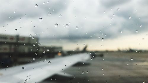 Full frame shot of wet glass window in rainy season