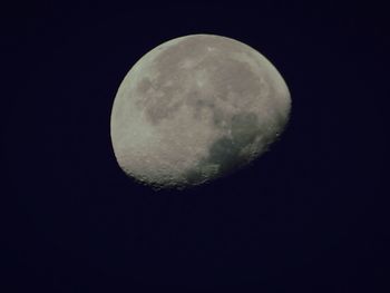 Low angle view of moon against sky at night