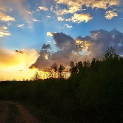 Scenic view of landscape against cloudy sky