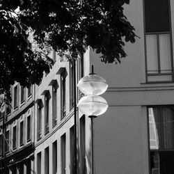 Low angle view of illuminated light against building