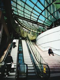 Low angle view of man standing on staircase