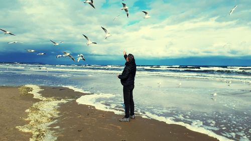 Full length of man on beach against sky