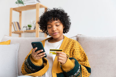 Young woman using mobile phone