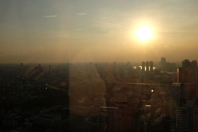 High angle view of buildings against sky during sunset