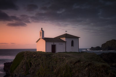 Hermitage on the coast during a dreamlike sunset