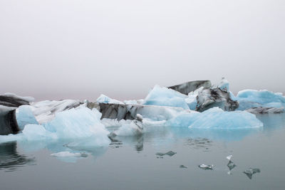 Iceberg on jokulsarlon lagoon against clear sky