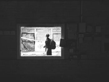 Man standing by window