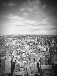 High angle view of city against cloudy sky