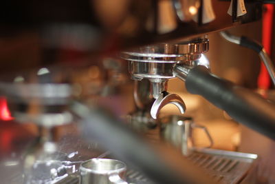 Close-up of coffee maker in coffee shop