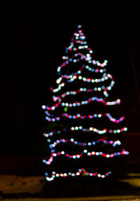 Illuminated christmas tree at night